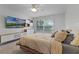 Bright bedroom with modern shelving and large windows overlooking a scenic view at 11908 Delfina Ln, Orlando, FL 32827