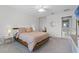 Cozy bedroom with ambient lighting under bed, plush carpets, and a view of the bathroom at 11908 Delfina Ln, Orlando, FL 32827