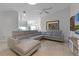 Comfortable living room features an L-shaped sofa, neutral walls, and ceiling fan at 11908 Delfina Ln, Orlando, FL 32827