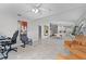 Bright, open-concept living room featuring tile floors, neutral walls, and stylish contemporary decor at 11908 Delfina Ln, Orlando, FL 32827