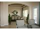 Dining area with a dining table and chairs, a decorative mirror, and ample natural light at 12030 Waterstone Loop Dr, Windermere, FL 34786