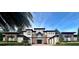 Stunning two-story home boasting a symmetrical façade, lush landscaping, and a paver driveway at 12030 Waterstone Loop Dr, Windermere, FL 34786