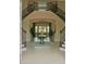 Elegant foyer featuring a grand staircase with decorative iron railings and a decorative table at 12030 Waterstone Loop Dr, Windermere, FL 34786