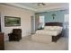 Inviting main bedroom featuring carpet, a bed with a decorative headboard, and wall art at 12030 Waterstone Loop Dr, Windermere, FL 34786