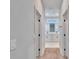 Hallway view of a modern bathroom with a double vanity and a window over the sinks at 13068 Sw 36Th Ct, Ocala, FL 34473