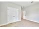 This is a bedroom with carpet and double-door closet, in a gray interior at 13068 Sw 36Th Ct, Ocala, FL 34473