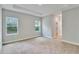 Spacious carpeted main bedroom with trey ceiling and two bright windows at 13068 Sw 36Th Ct, Ocala, FL 34473