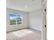 Bright, carpeted bedroom with a large window offering a view of the outdoors at 13068 Sw 36Th Ct, Ocala, FL 34473