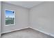 This is a gray carpeted bedroom with a window at 13068 Sw 36Th Ct, Ocala, FL 34473