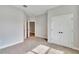 An ample bedroom space featuring plush carpeting, ample sunlight, and entry to the en-suite bathroom at 13068 Sw 36Th Ct, Ocala, FL 34473