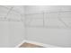 This is a walk-in closet with carpet flooring and white wire shelving at 13068 Sw 36Th Ct, Ocala, FL 34473