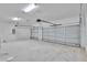 Spacious garage featuring two overhead doors and concrete flooring at 13068 Sw 36Th Ct, Ocala, FL 34473