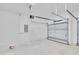 Spacious two-car garage with an automatic door opener, high ceilings and ample room for parking and storage at 13068 Sw 36Th Ct, Ocala, FL 34473