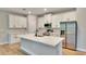 A well-appointed kitchen features white cabinets, quartz counters, and stainless steel appliances; ideal for cooking at 13068 Sw 36Th Ct, Ocala, FL 34473