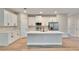 The gourmet kitchen is equipped with a central island, stainless appliances and quartz countertops at 13068 Sw 36Th Ct, Ocala, FL 34473