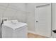 Laundry room with Samsung washer, utility sink, white door and shelf at 13068 Sw 36Th Ct, Ocala, FL 34473