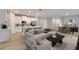 Cozy living room with stylish furnishings, open to a modern kitchen with a breakfast bar at 13068 Sw 36Th Ct, Ocala, FL 34473