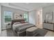 Comfortable main bedroom features abundant natural light and a neutral color palette at 13068 Sw 36Th Ct, Ocala, FL 34473