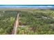 Aerial view showcases home nestled amid an expansive woodland and natural surroundings at 13297 Sw 69Th Pl, Ocala, FL 34481