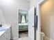 An en suite bathroom and connecting bedroom at 13297 Sw 69Th Pl, Ocala, FL 34481