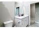 Bathroom with a white vanity, mirror, and toilet at 13297 Sw 69Th Pl, Ocala, FL 34481