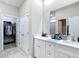 Bright bathroom featuring double sinks and ample cabinet space and closet at 13297 Sw 69Th Pl, Ocala, FL 34481