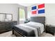 This bedroom features a window and a dresser at 13297 Sw 69Th Pl, Ocala, FL 34481