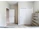 Bedroom featuring a doorway leading to a hallway and a closet with sliding doors at 13297 Sw 69Th Pl, Ocala, FL 34481