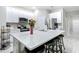 Open concept kitchen with center island, bar seating, and stainless steel appliances at 13297 Sw 69Th Pl, Ocala, FL 34481