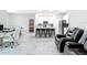 Open concept living room with tile flooring, kitchen view, and a dedicated office area at 13297 Sw 69Th Pl, Ocala, FL 34481