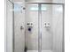 Beautifully tiled shower with glass doors and a convenient shower niche at 13297 Sw 69Th Pl, Ocala, FL 34481