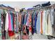 Walk-in closet featuring organized clothing racks and shelves with storage for shoes and bags at 13297 Sw 69Th Pl, Ocala, FL 34481