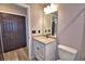 The bathroom includes a modern vanity with a granite countertop and a closet in view at 1390 E Wabash St, Bartow, FL 33830