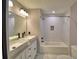 Bathroom with double vanity and shower over tub at 1390 E Wabash St, Bartow, FL 33830