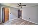 Spacious bedroom boasting wood-look floors, ceiling fan, and closet, ideal for comfort at 1390 E Wabash St, Bartow, FL 33830