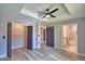 Bedroom with closet, bathroom, ceiling fan and recessed ceiling at 1390 E Wabash St, Bartow, FL 33830