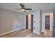 Bright bedroom with luxury vinyl flooring, closet, and dark doors and trim at 1390 E Wabash St, Bartow, FL 33830