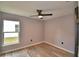 Bedroom with light, neutral paint, luxury vinyl flooring, and a modern ceiling fan at 1390 E Wabash St, Bartow, FL 33830