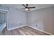 Well-lit bedroom featuring wood-look flooring and ceiling fan, offering a comfortable atmosphere at 1390 E Wabash St, Bartow, FL 33830