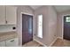 Welcoming entryway area, with a front door, fresh paint, and updated flooring at 1390 E Wabash St, Bartow, FL 33830
