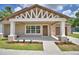 Charming single-story home featuring a covered porch with stylish columns and a well-manicured front yard at 1390 E Wabash St, Bartow, FL 33830