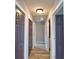 Hallway with dark doors and luxury vinyl flooring at 1390 E Wabash St, Bartow, FL 33830