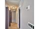 Hallway with gray walls, wood floors, and white trim at 1390 E Wabash St, Bartow, FL 33830