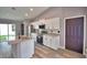 Modern kitchen featuring stainless steel appliances, granite countertops, and an island at 1390 E Wabash St, Bartow, FL 33830