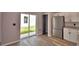 Updated kitchen featuring stainless steel appliances, fresh paint, and a glass door to backyard at 1390 E Wabash St, Bartow, FL 33830