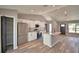 Well-equipped kitchen with stainless steel appliances, a central island, and ample storage space at 1390 E Wabash St, Bartow, FL 33830