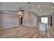 Spacious living room featuring hard surface floors, a ceiling fan, recessed lighting, and a kitchen island at 1390 E Wabash St, Bartow, FL 33830