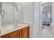 Bathroom features a vanity with a marble countertop and a view into an adjacent bedroom at 14003 Hampshire Bay Cir, Winter Garden, FL 34787