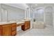 Well-lit bathroom with a soaking tub, walk-in shower, and dual sinks at 14003 Hampshire Bay Cir, Winter Garden, FL 34787