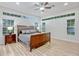 Spacious bedroom with wood floors, large windows, and a ceiling fan at 14003 Hampshire Bay Cir, Winter Garden, FL 34787